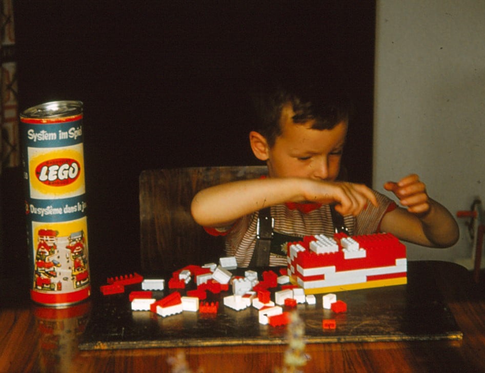 A child playing with LEGO bricks.